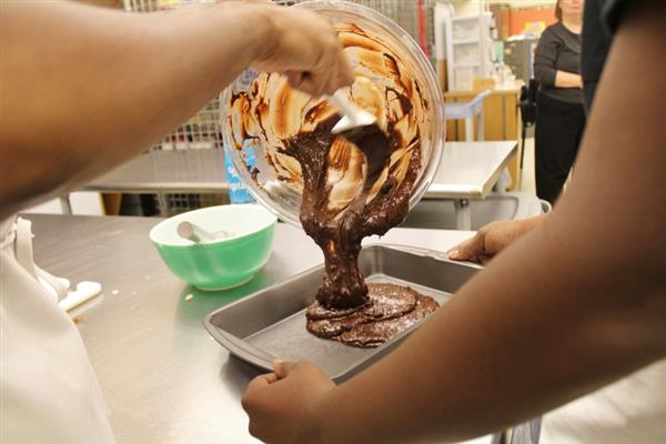 pouring brownie batter